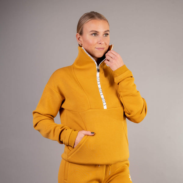 Orange sweater with white zipper for women from BARA Sportswear